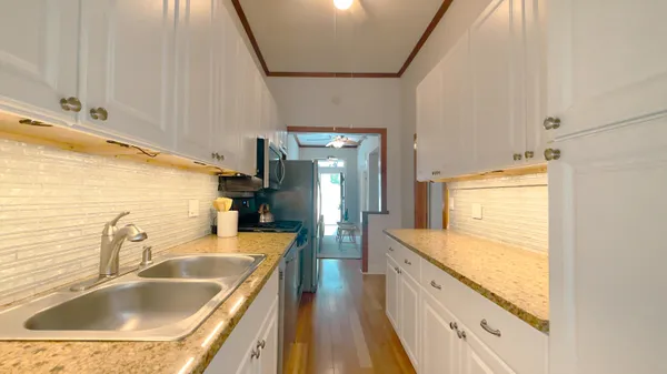 a dining room with furniture and wooden floor