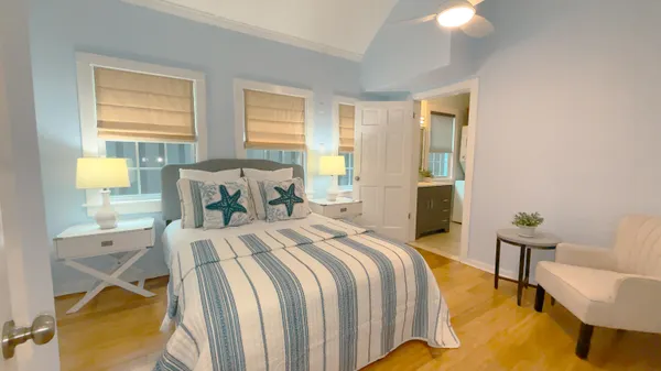 a bedroom with a bed and a lamp