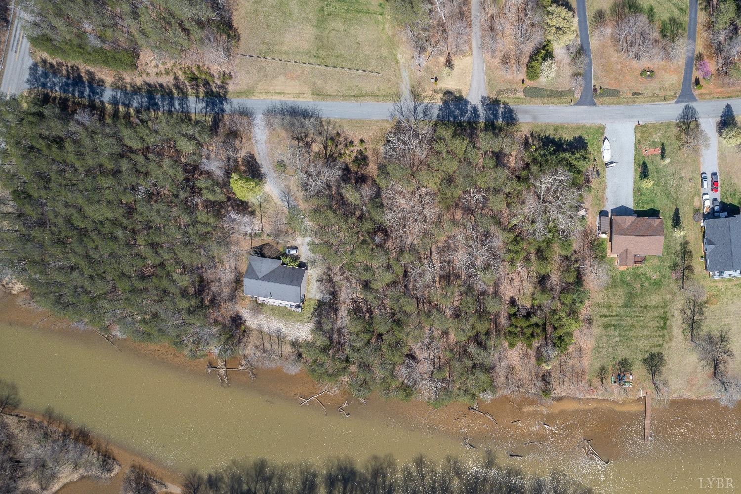 4 Inlet Drive Wirtz, VA 24184 - Photo 1 of 11 a aerial view of a house with a yard and large trees
