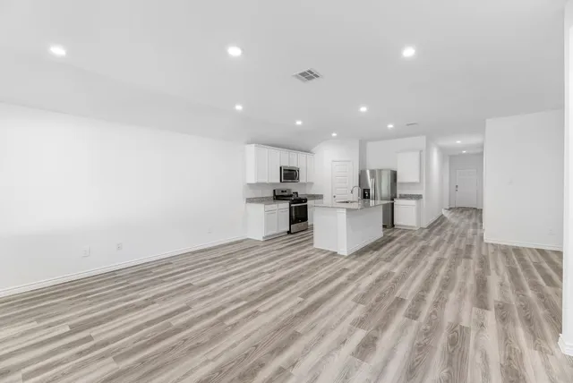 a view of kitchen with wooden floor