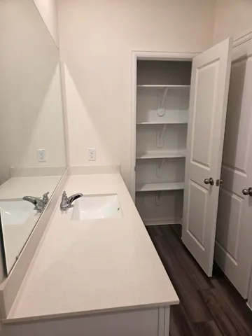 a view of a kitchen from a hallway