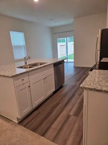 a kitchen with sink and window