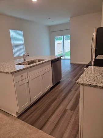 a kitchen with sink and window