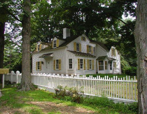 235 Redding Road Easton, CT 06612 - Photo 1 of 1 a front view of a house with a garden and plants