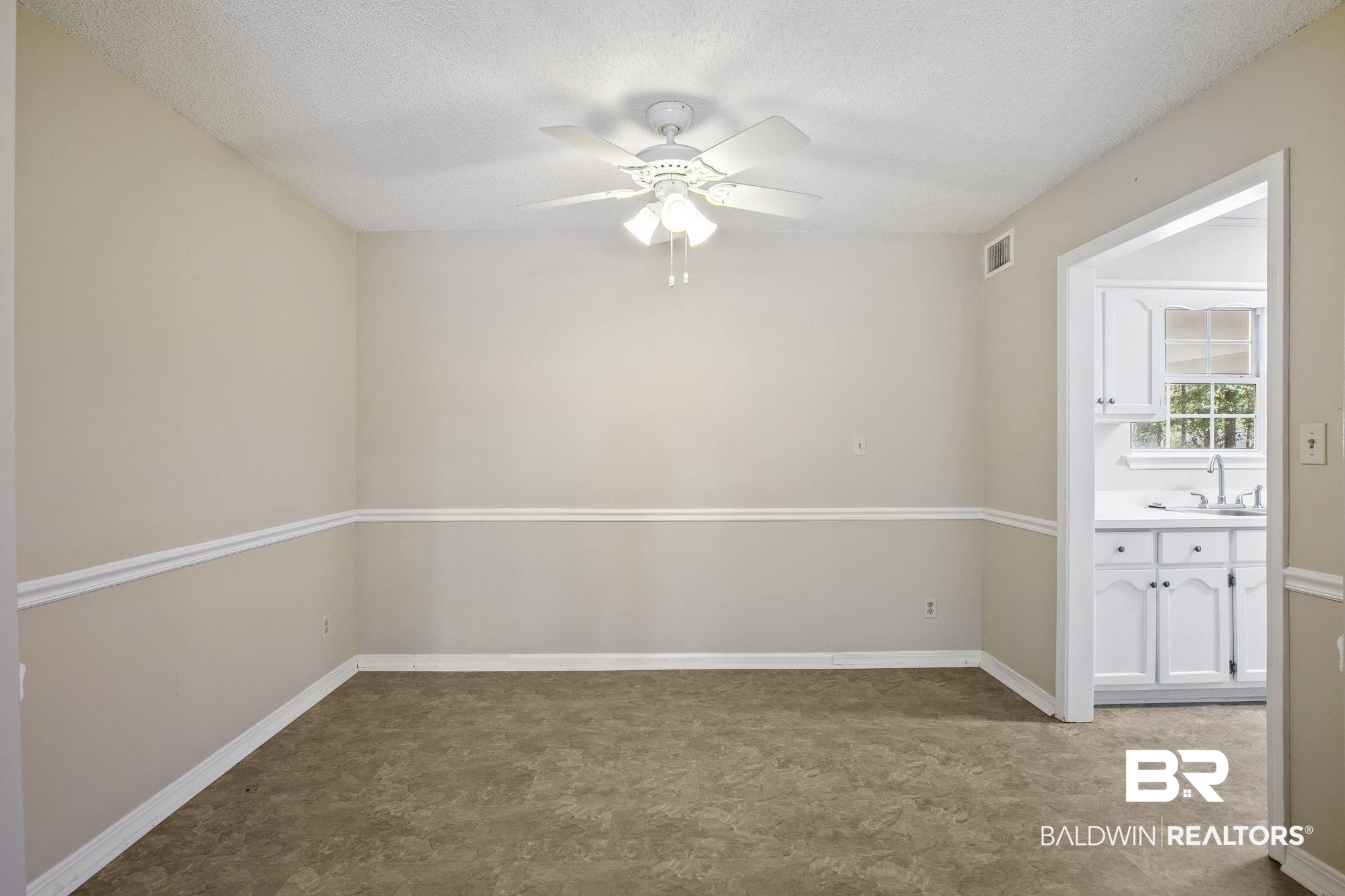 359 Ridgewood Drive Daphne, AL 36526 - Photo 18 of 73 Dining room is off the galley kitchen and living room