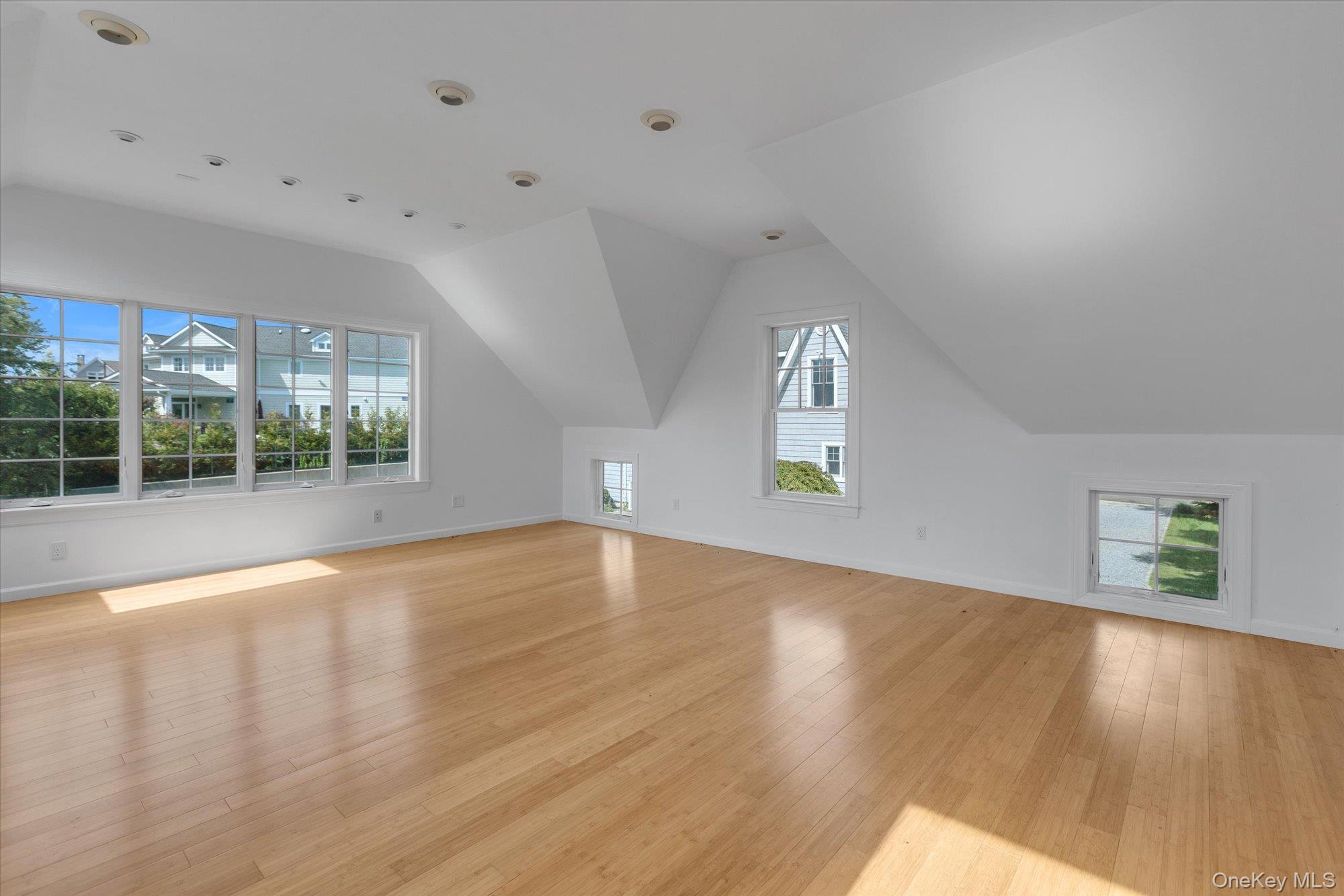 1155 Tasker Lane Greenport, NY 11944 - Photo 17 of 25 Bonus room featuring plenty of natural light, light wood finished floors, and lofted ceiling