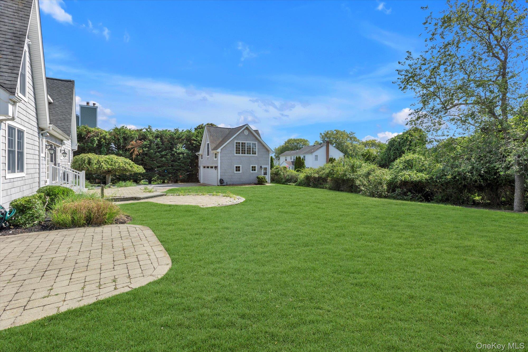 1155 Tasker Lane Greenport, NY 11944 - Photo 21 of 25 View of green lawn with view of scattered trees