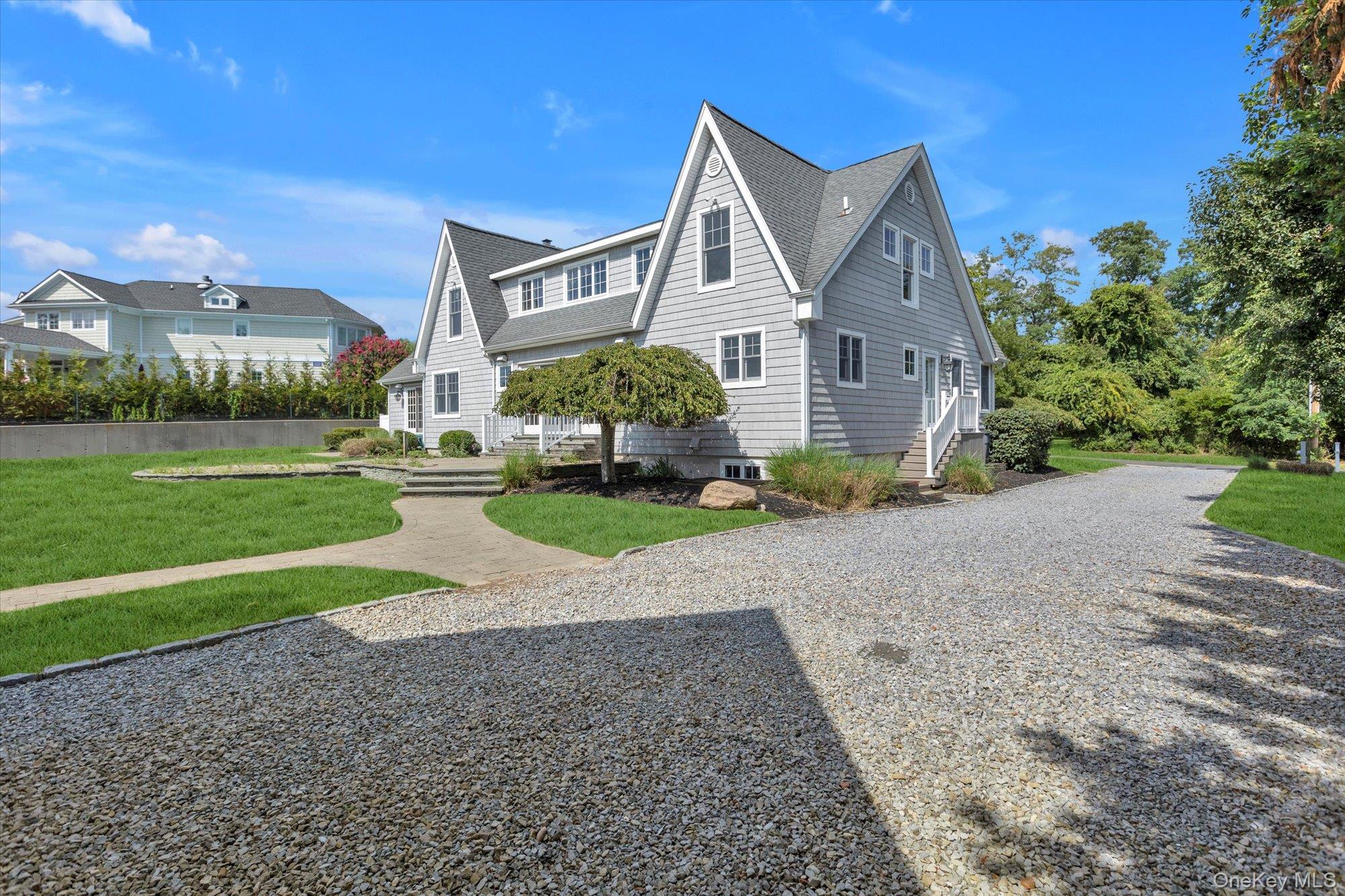 1155 Tasker Lane Greenport, NY 11944 - Photo 23 of 25 View of front of property with a front yard and roof with shingles