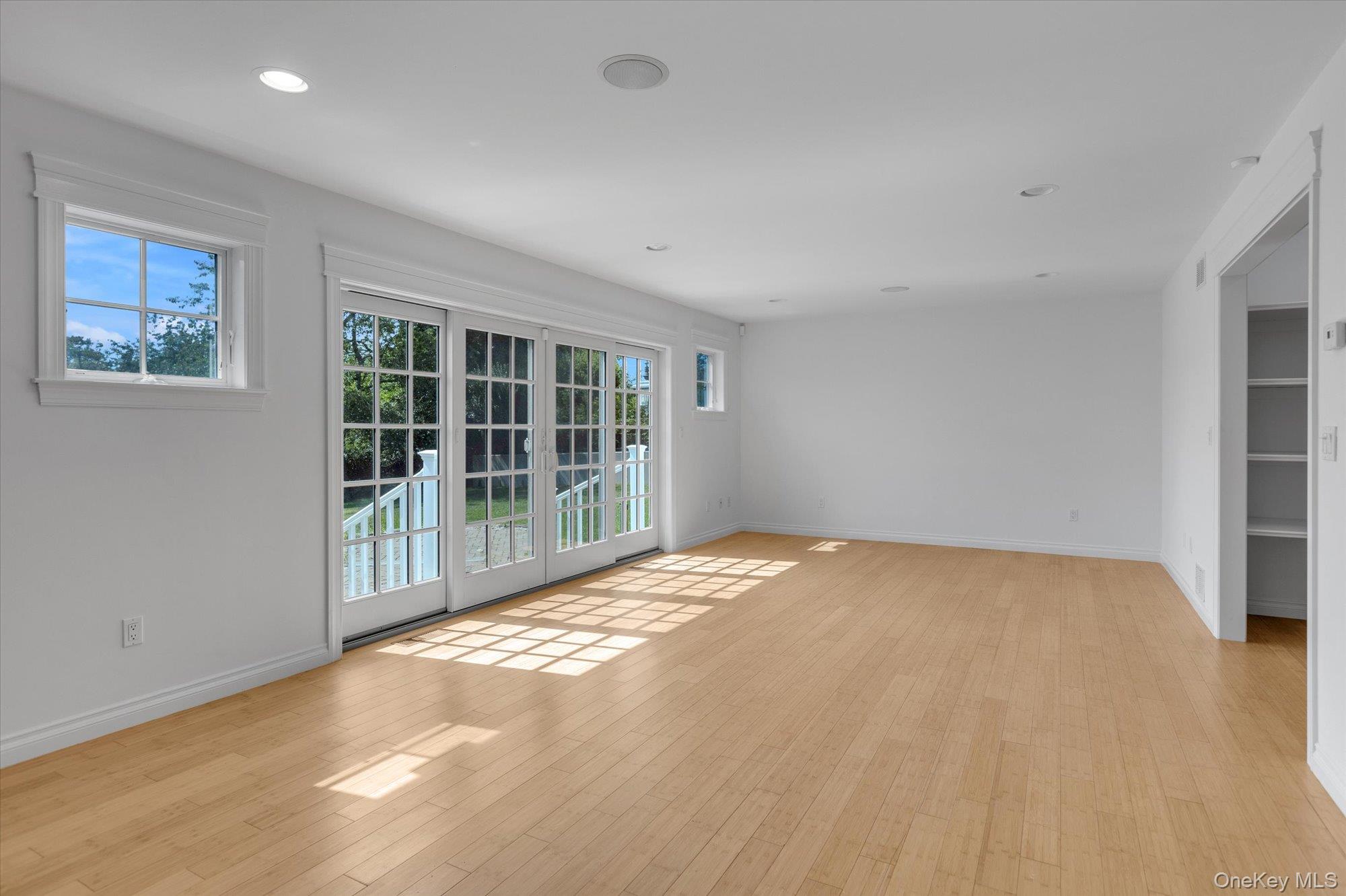 1155 Tasker Lane Greenport, NY 11944 - Photo 4 of 25 Unfurnished room with light wood-type flooring and recessed lighting