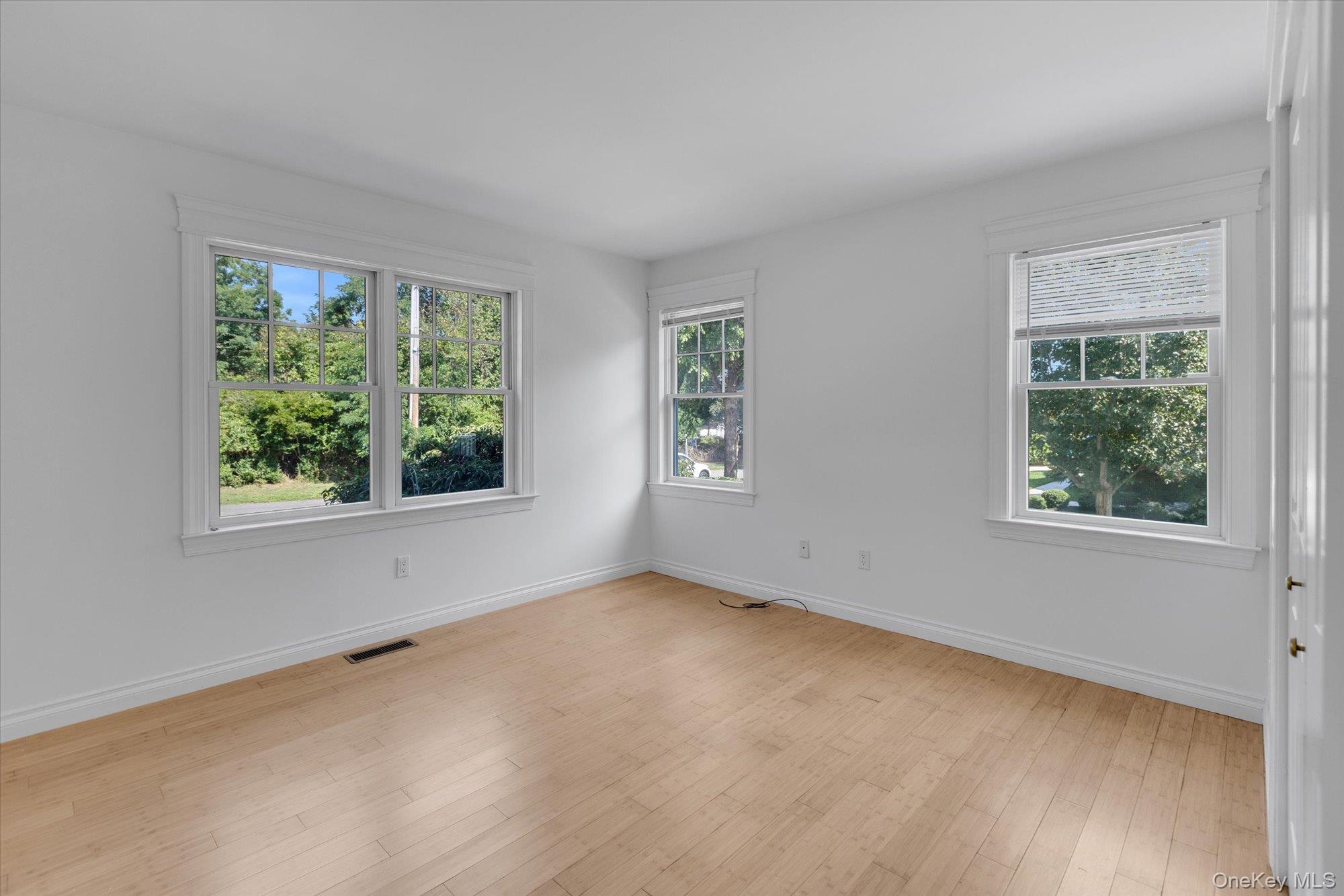 1155 Tasker Lane Greenport, NY 11944 - Photo 9 of 25 Unfurnished room with baseboards and light wood-style flooring