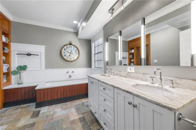a en suite bathroom with a sink and a mirror