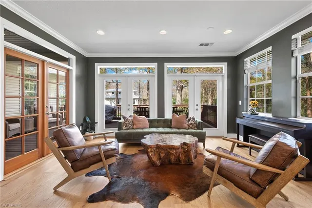 a patio with wooden floor and outdoor seating