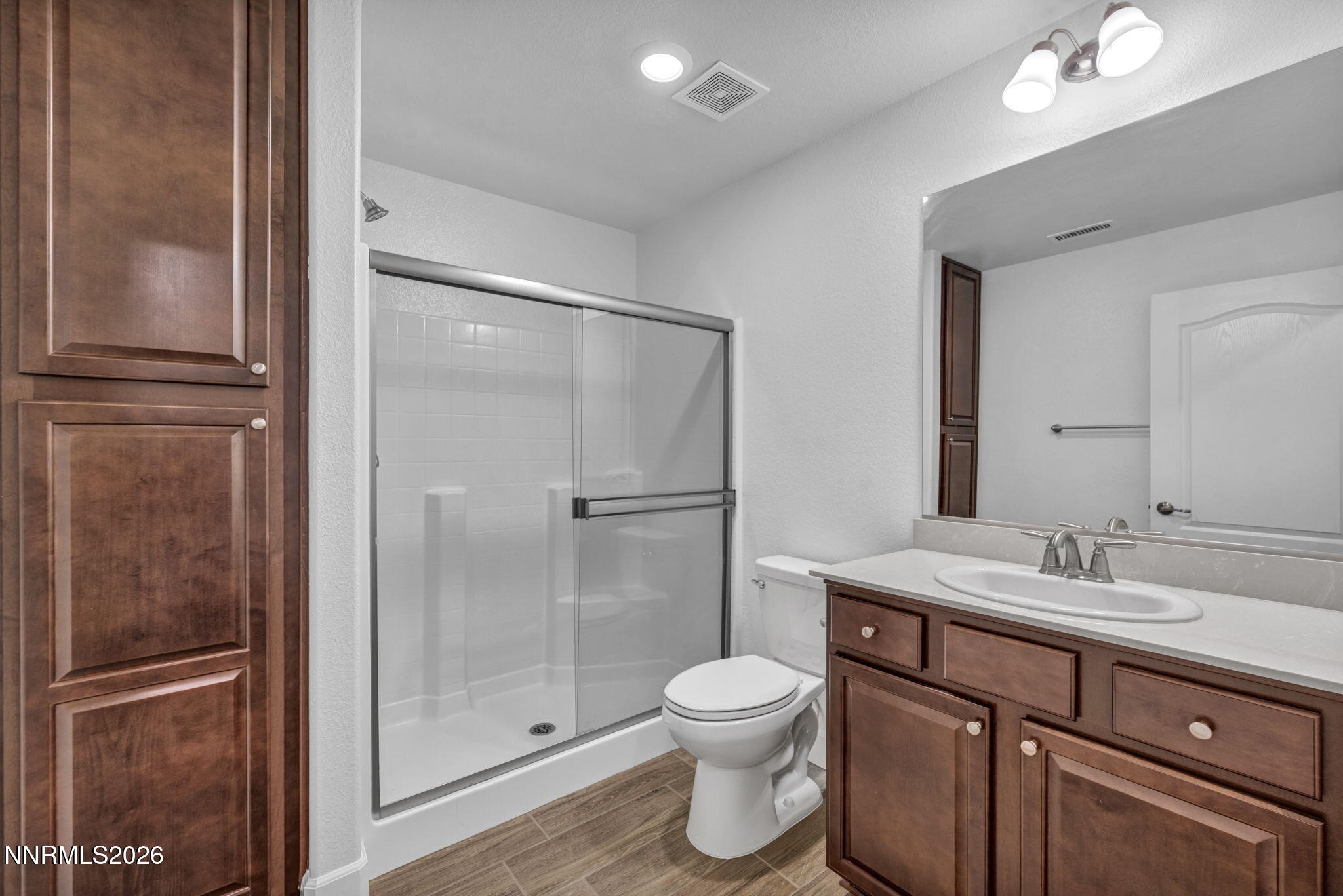 7181 Saddlehorn Road Carson City, NV 89701 - Photo 40 of 62 a bathroom with a toilet sink and shower