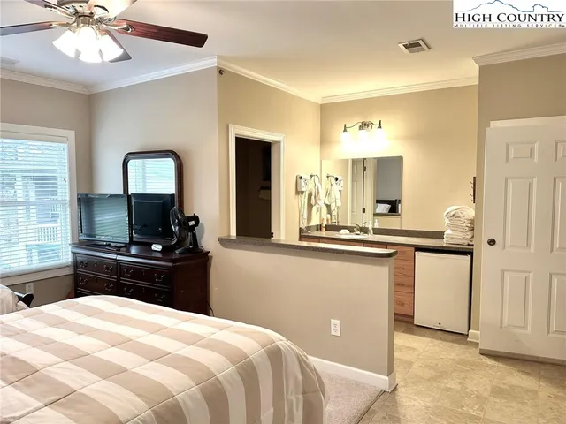 a kitchen with a refrigerator and a sink
