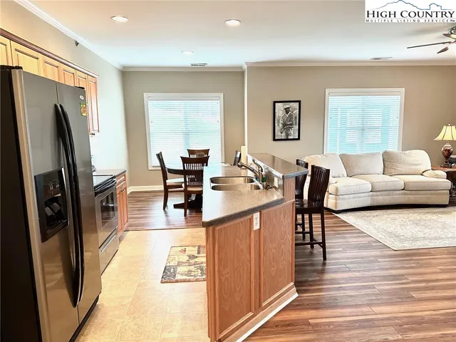 a living room with fireplace furniture and a flat screen tv