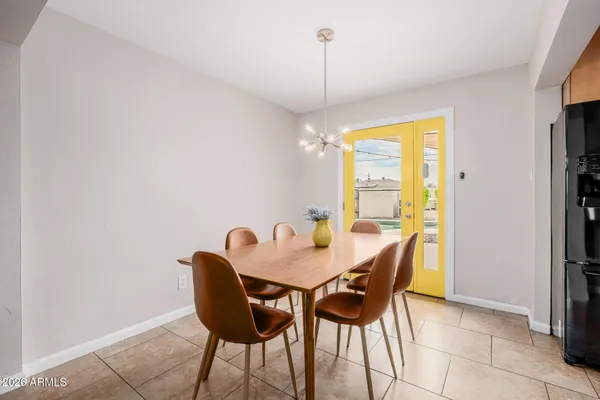 a view of a dining room with furniture and window