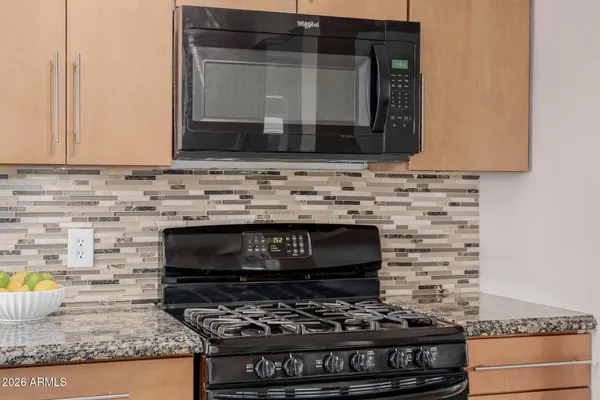 a view of a kitchen island with a window and wooden floor