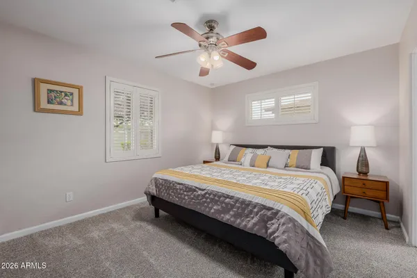 a bedroom with a bed and a dresser
