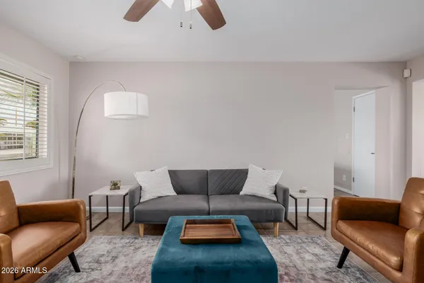 a living room with furniture and a window
