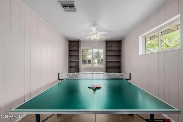 a bathroom with a sink mirror and shower