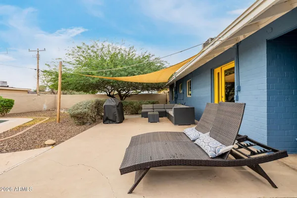 a view of a house with a backyard space