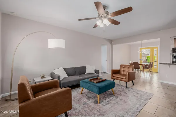 a living room with furniture and a large window