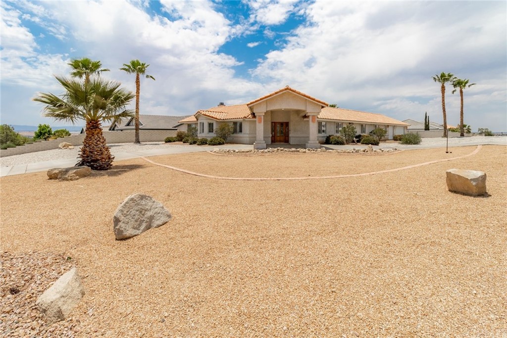 16282 Ridge View Drive Apple Valley, CA 92307 - Photo 1 of 1 a front view of a house with a yard