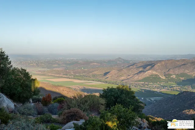 a view of a outdoor dining space with a table and chairs
