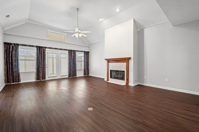 a kitchen with stainless steel appliances granite countertop a sink refrigerator and cabinets