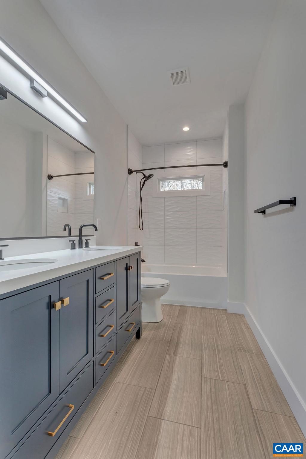 97 Daddy Rabbit Court Ruckersville, VA 22968 - Photo 23 of 48 a bathroom with a double vanity sink and a mirror