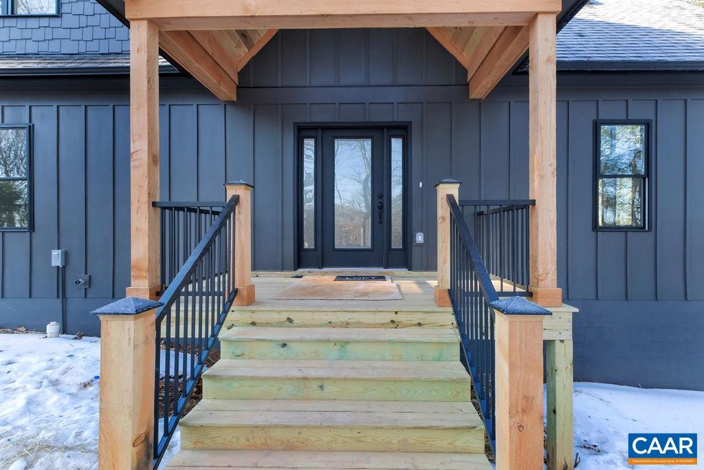 97 Daddy Rabbit Court Ruckersville, VA 22968 - Photo 5 of 48 a view of staircase with white walls and railing