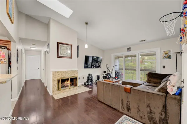 a living room with furniture fireplace and flat screen tv