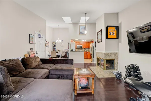 a living room with furniture fireplace and flat screen tv