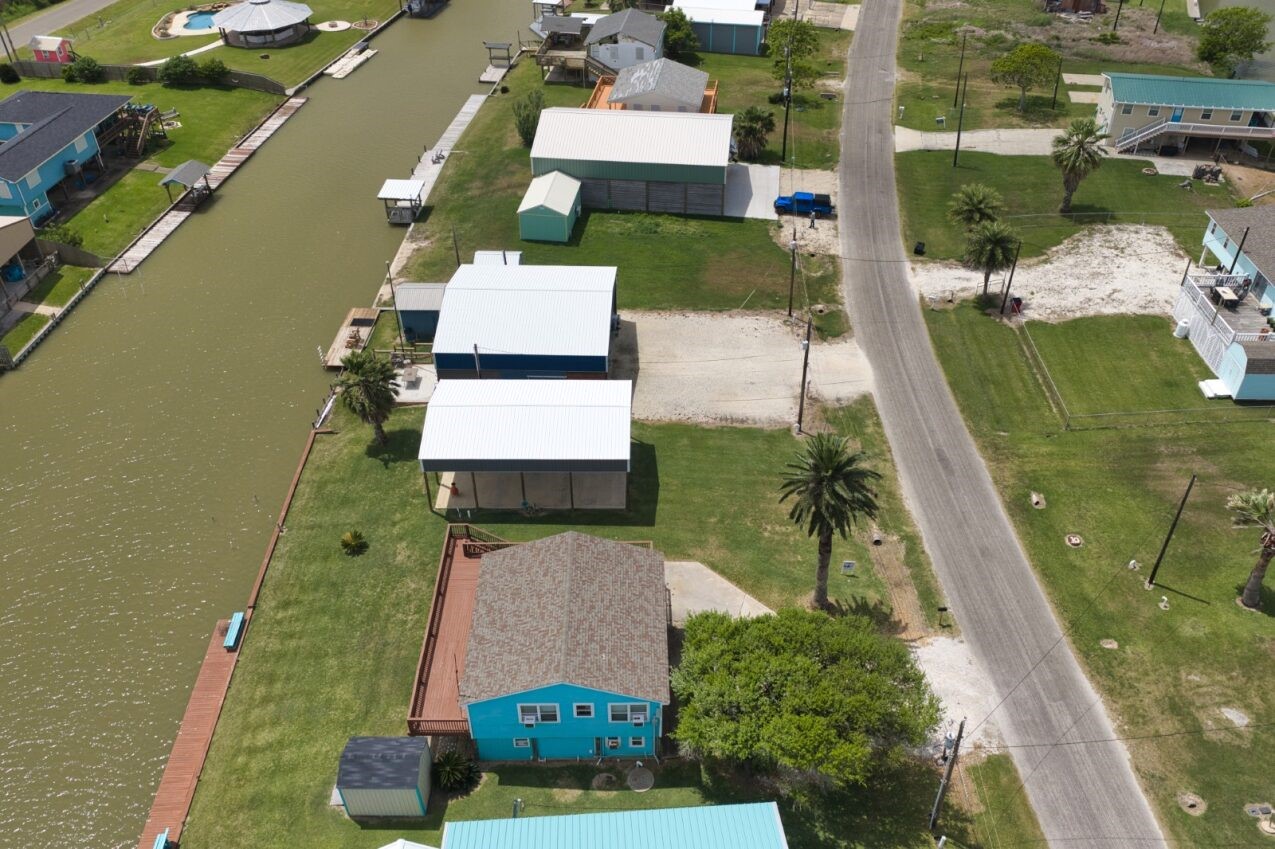 511 County Road 202 Sargent, TX 77414 - Photo 7 of 12 an aerial view of a house with a yard
