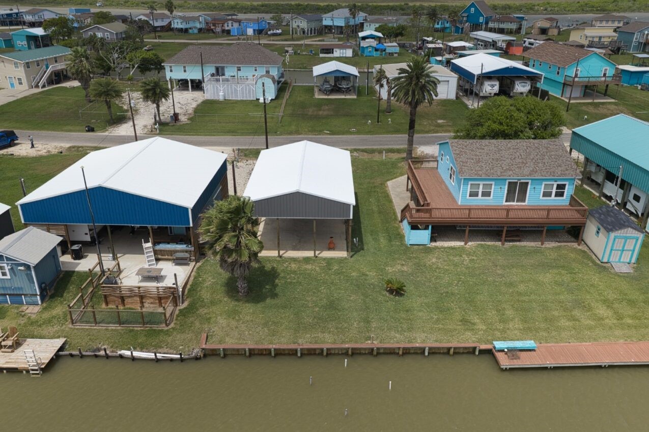 511 County Road 202 Sargent, TX 77414 - Photo 8 of 12 an aerial view of residential houses with outdoor space