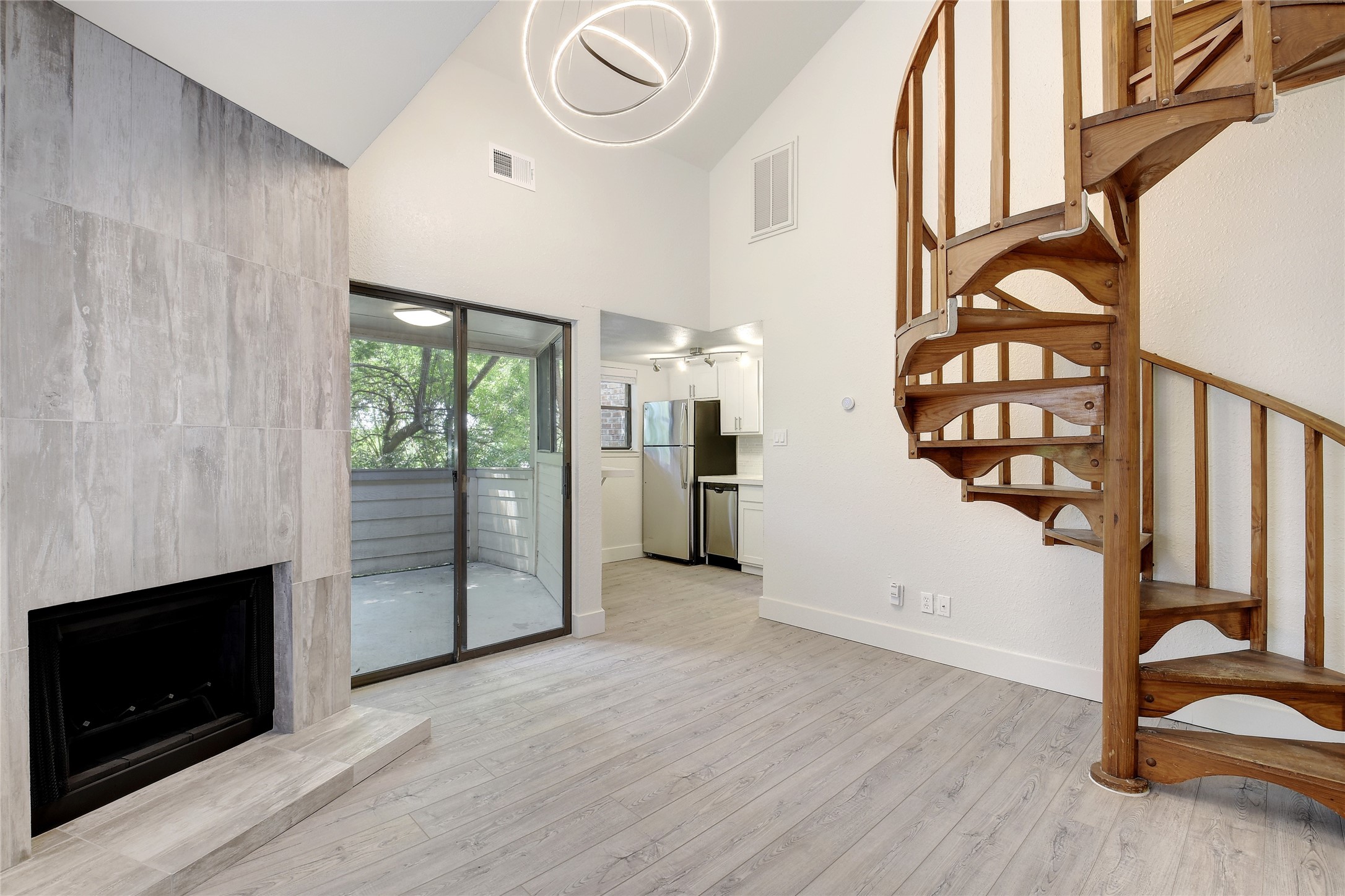 wooden floor in an empty room with a fireplace