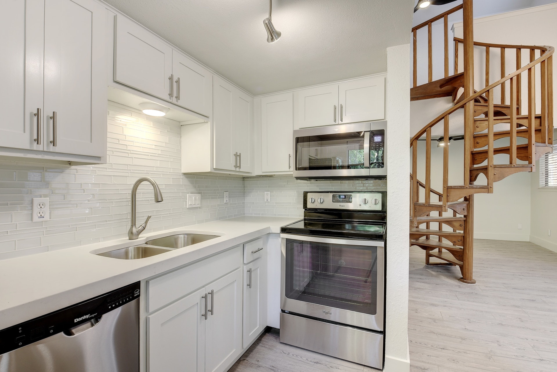 2500 Burleson Road, Unit 719 Austin, TX 78741 - Photo 11 of 22 a kitchen with stainless steel appliances granite countertop a sink and a stove