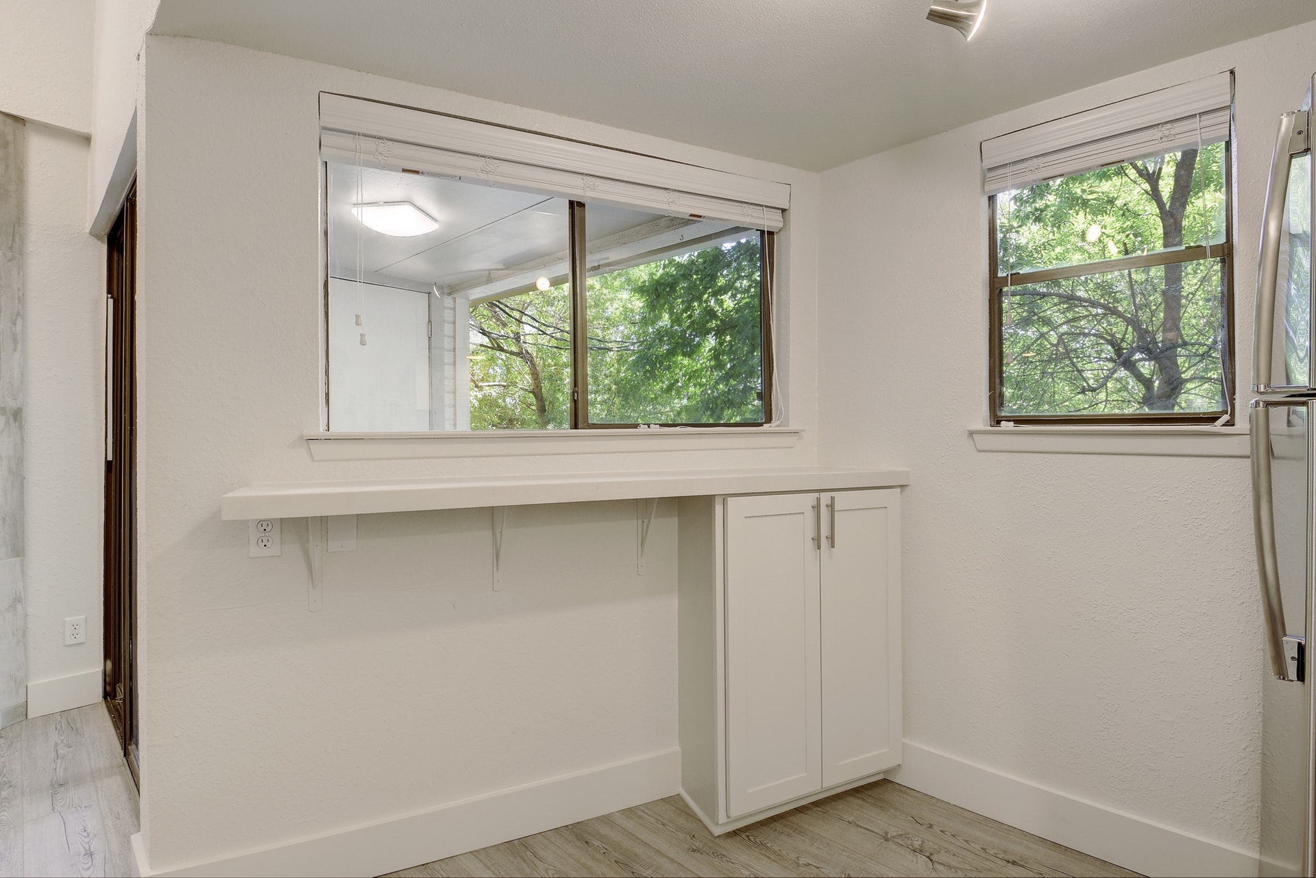 2500 Burleson Road, Unit 719 Austin, TX 78741 - Photo 13 of 22 an empty room with a window and wooden floor