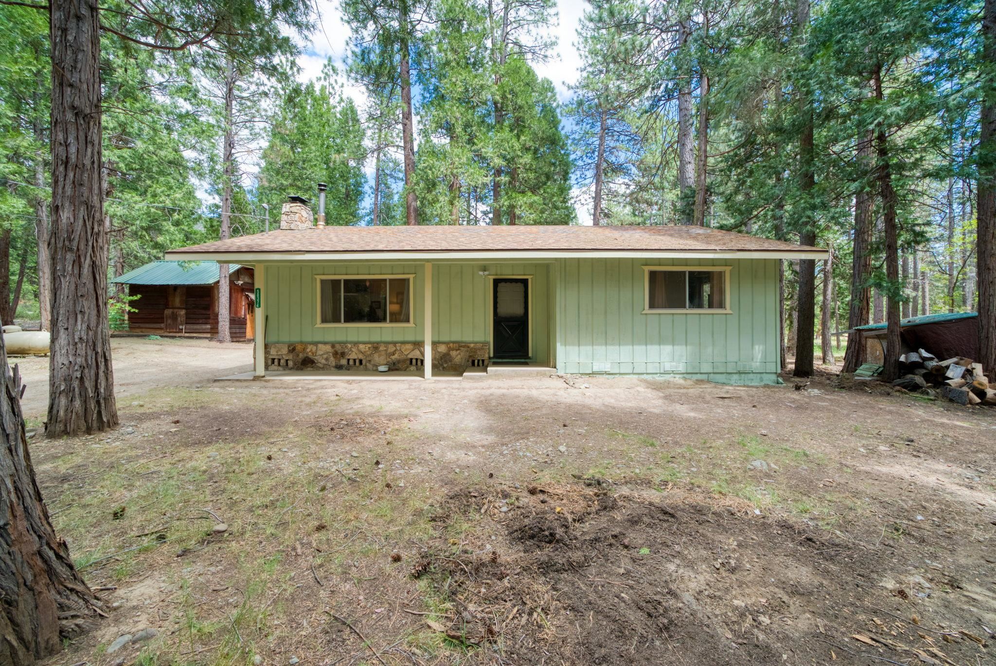 58374 Gill Ranch Road Cromberg, CA 96103 - Photo 1 of 44 a view of a house with a backyard