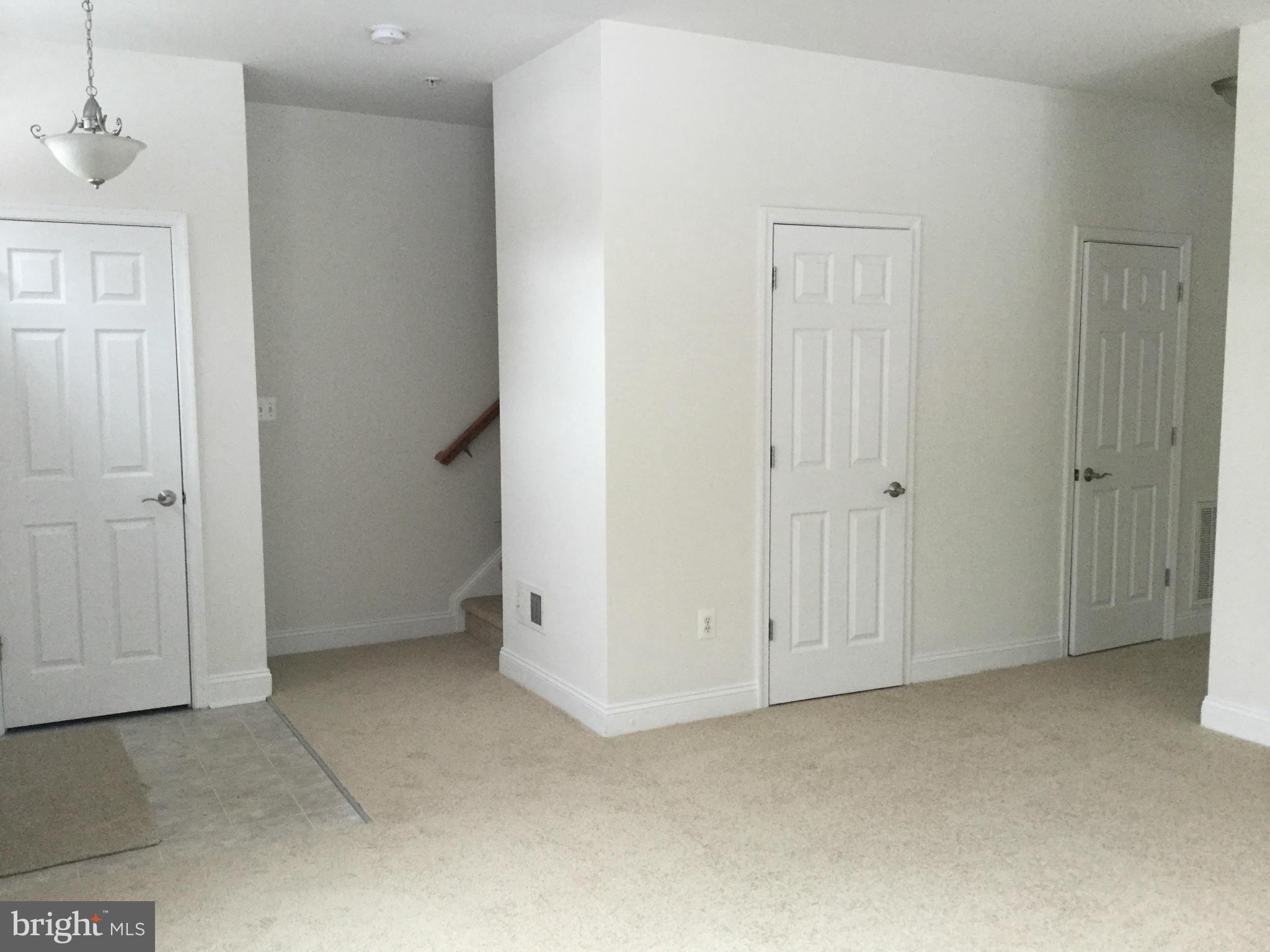 410 Ruddy Duck Court Cambridge, MD 21613 - Photo 20 of 20 Living room with 1/2 bath and storage closet
