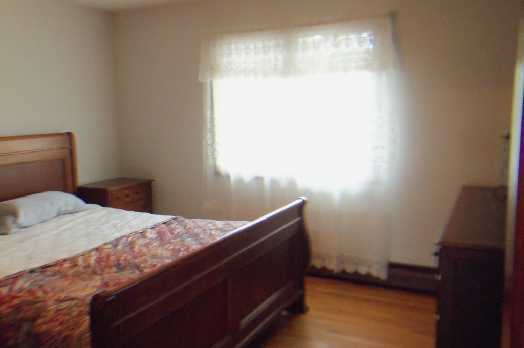 111 Anthony Fall River Fall River, MA 02721 - Photo 11 of 19 a bedroom with a bed and a window