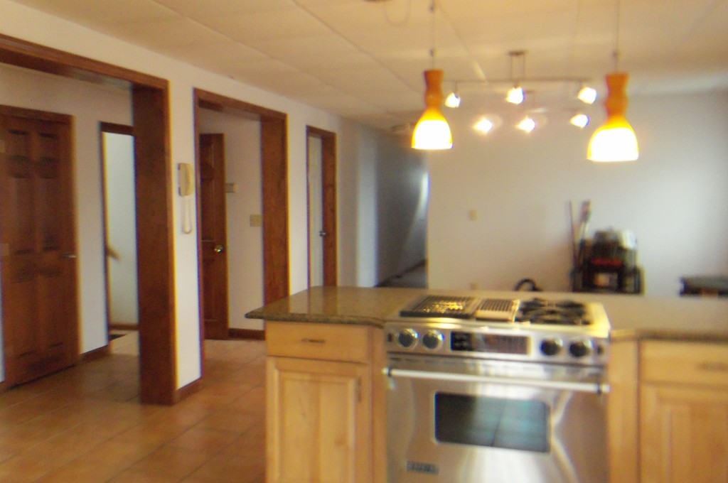 111 Anthony Fall River Fall River, MA 02721 - Photo 14 of 19 a kitchen with a stove and a refrigerator