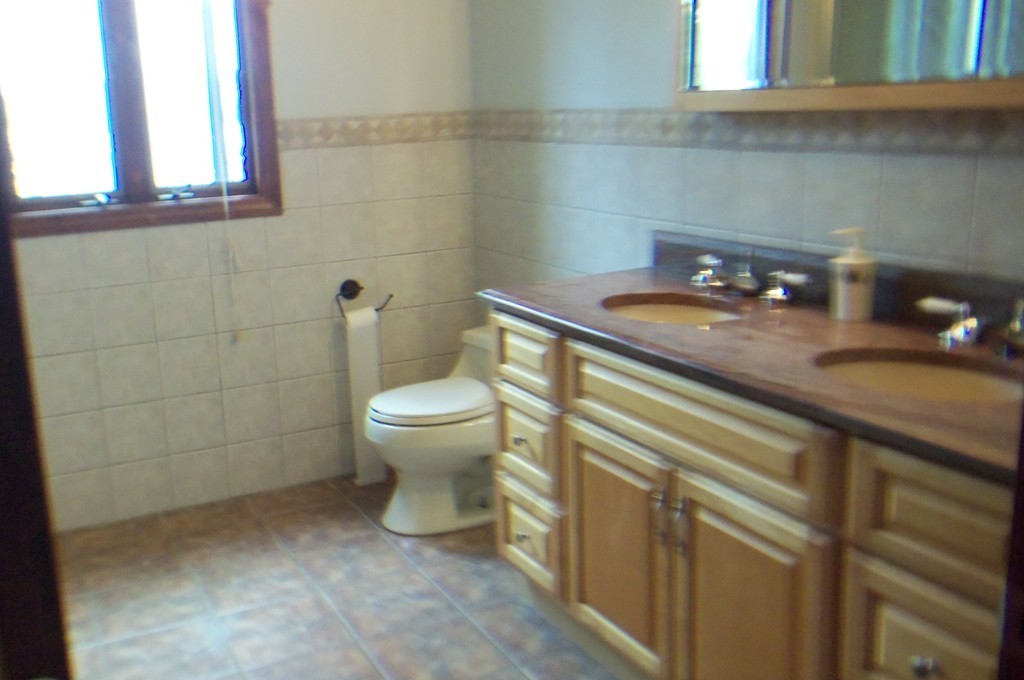 111 Anthony Fall River Fall River, MA 02721 - Photo 17 of 19 a bathroom with a sink a toilet and mirror