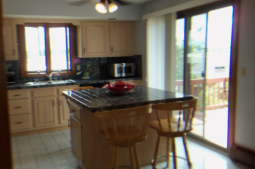 111 Anthony Fall River Fall River, MA 02721 - Photo 5 of 19 a kitchen with a stove a sink and a refrigerator