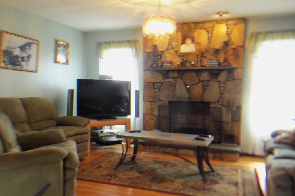 111 Anthony Fall River Fall River, MA 02721 - Photo 7 of 19 a living room with furniture and a fireplace