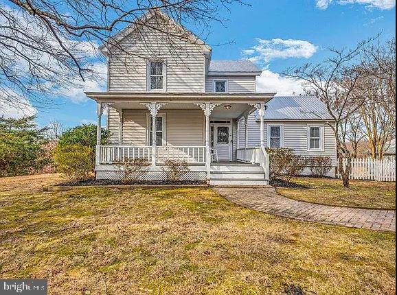 4090 Old Town Road Huntingtown, MD 20639 - Photo 2 of 42 a front view of a house with a yard