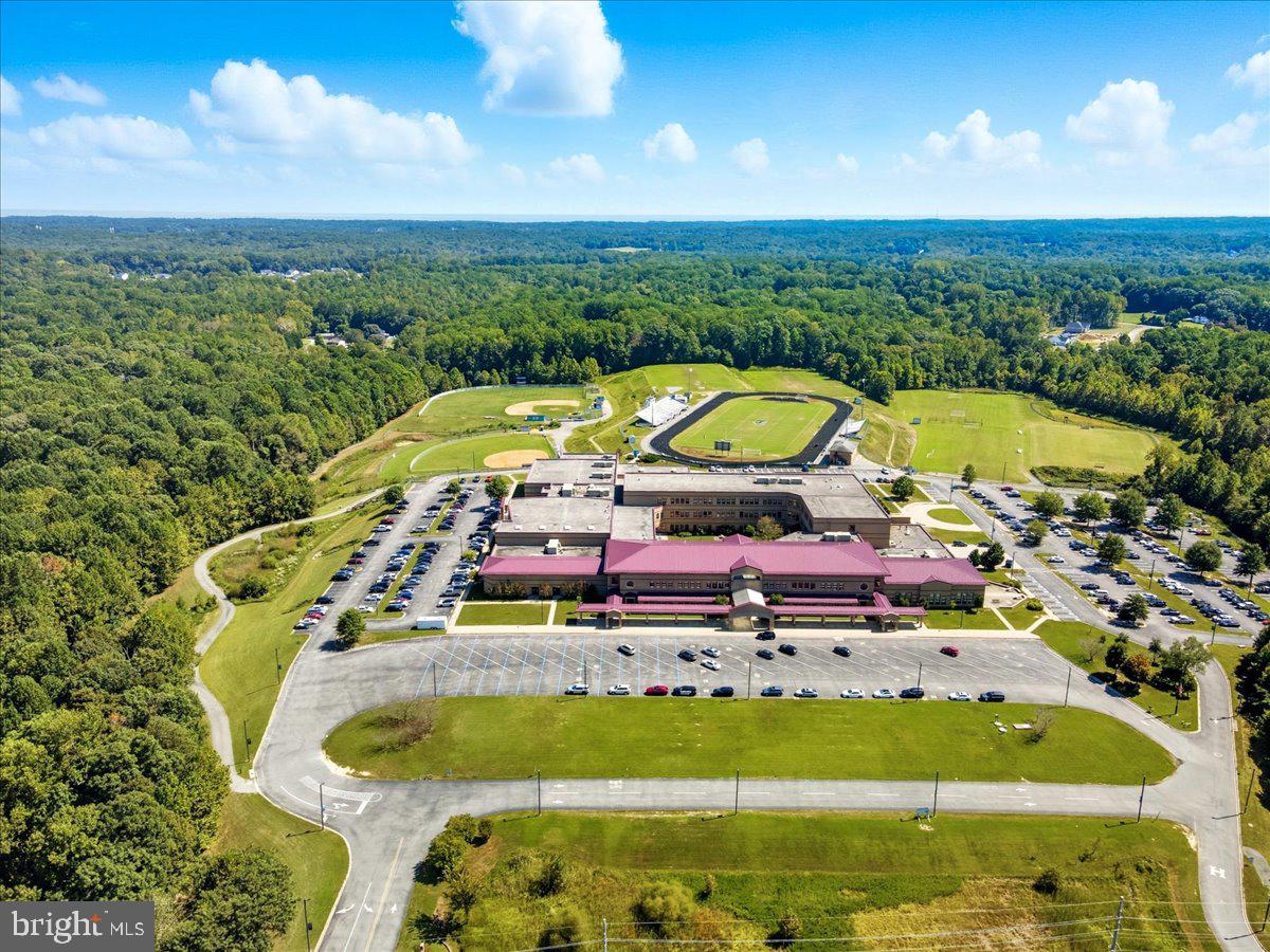4090 Old Town Road Huntingtown, MD 20639 - Photo 28 of 42 a view of a swimming pool with a table and chairs