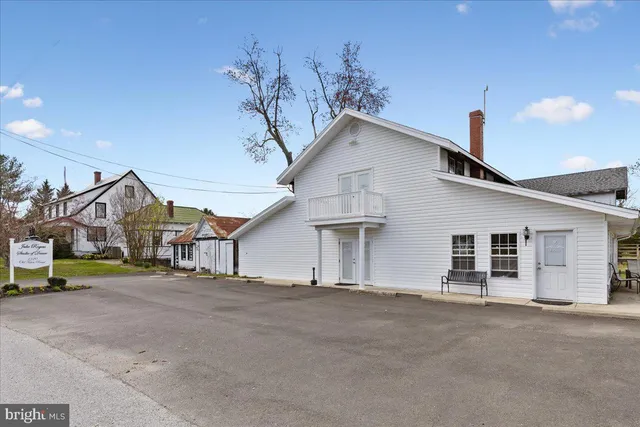 a view of a house with a street