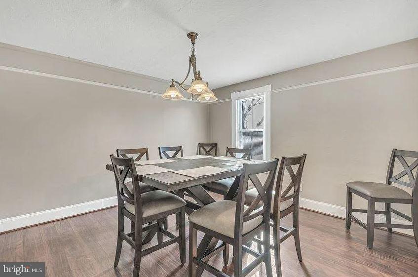 4090 Old Town Road Huntingtown, MD 20639 - Photo 7 of 42 a view of a dining room with furniture and wooden floor