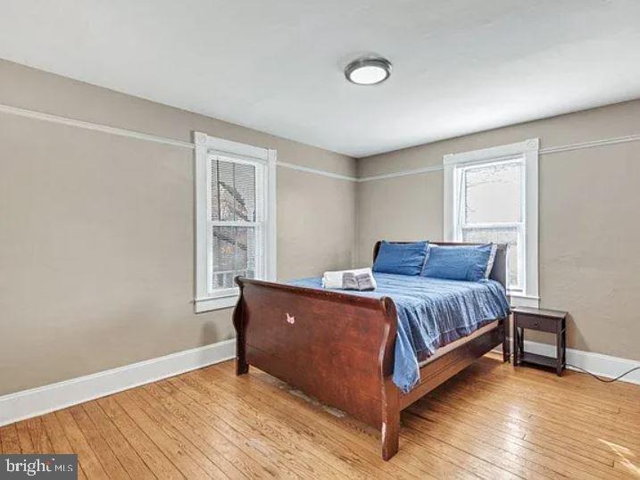 4090 Old Town Road Huntingtown, MD 20639 - Photo 9 of 42 a living room with a bed furniture and a window